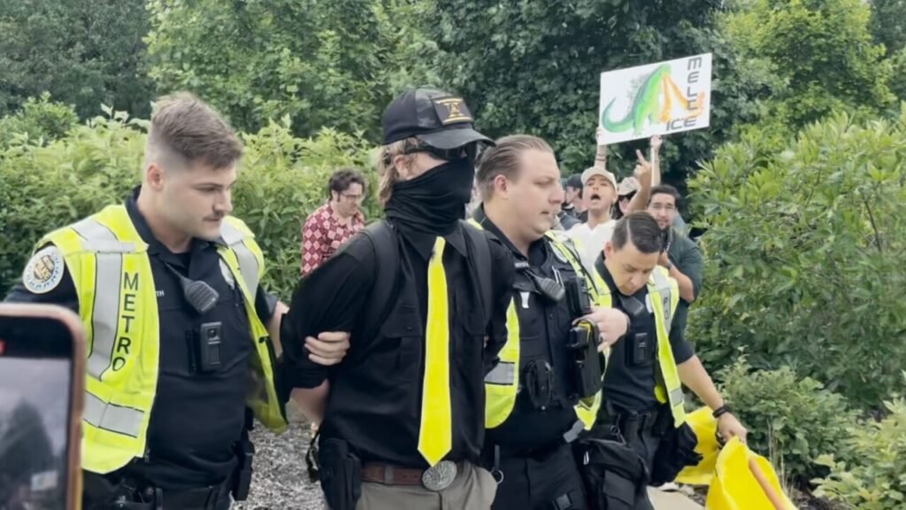 Elijah Millar Arrested at Protest with Gun and Extremist Symbols Elijah Millar Arrested at Protest with Gun and Extremist Symbols