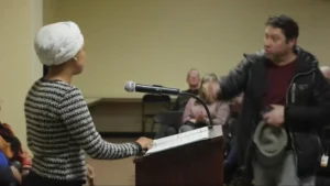 Man Sprays Ilhan Omar at Minneapolis Town Hall Man Sprays Ilhan Omar at Minneapolis Town Hall